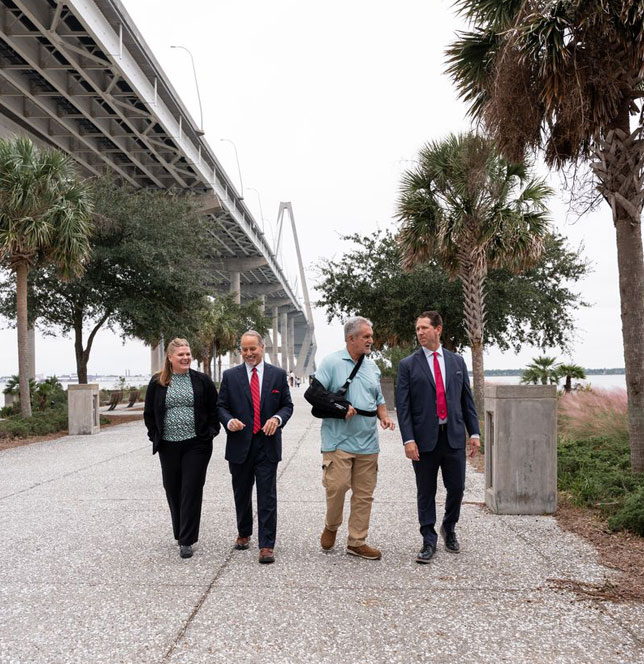 Peter David Brown legal team walking with an injured client in Charleston